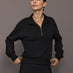Model is wearing the Half Zip Fleece Top in black with stand collar and front half-zip closure, front view.