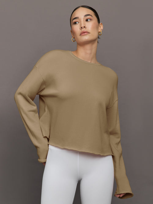 Model is wearing Crew Neck Sweatshirt in French Terry Chinchilla, front view.