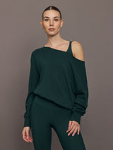 Model is wearing the Off Shoulder Sweatshirt in Forest, front view.