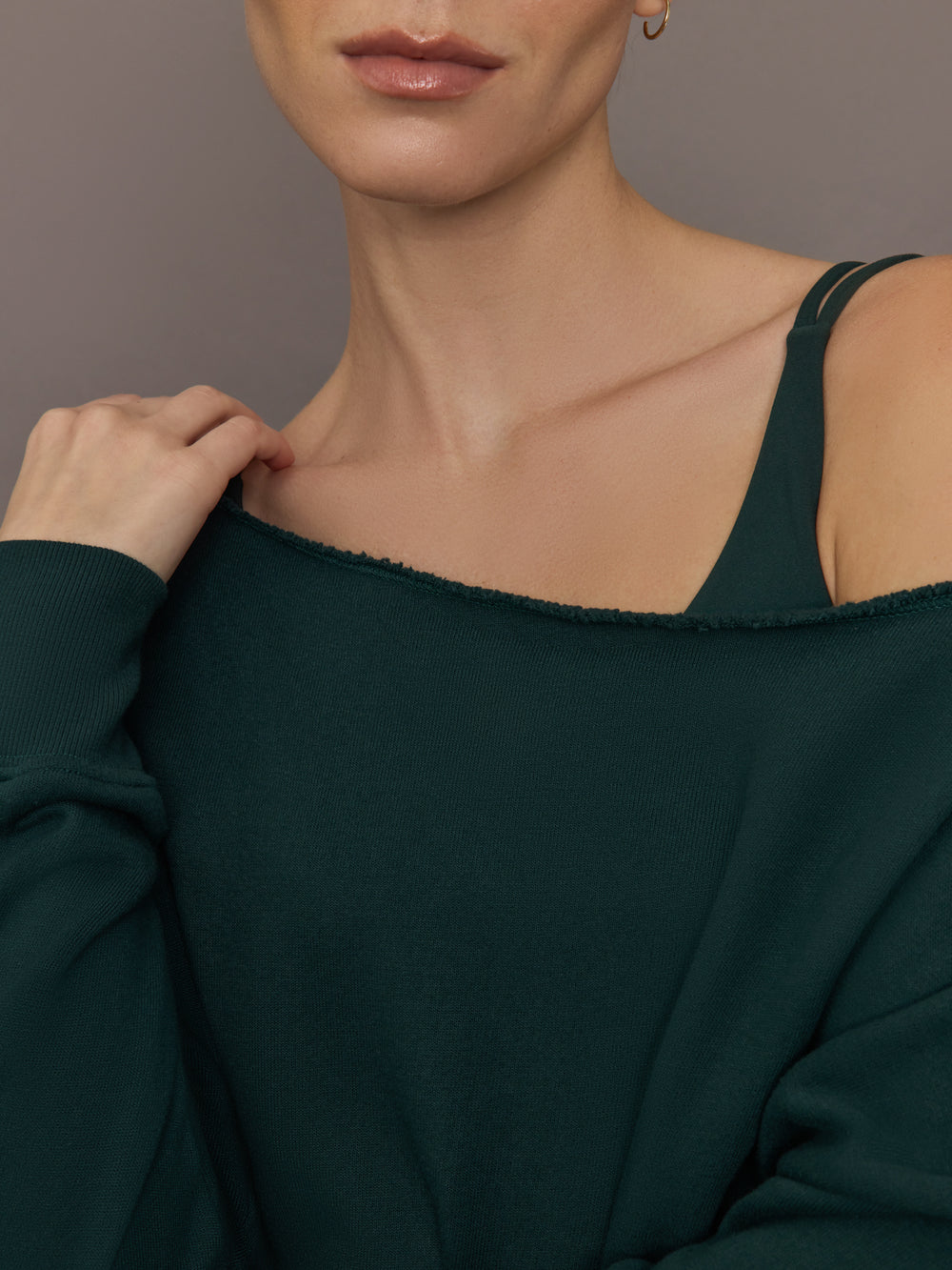 Close up of the Off Shoulder Sweatshirt in Forest, neckline detail.