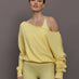 Model is wearing the French Terry Off-Shoulder Sweatshirt in Banana, front view.