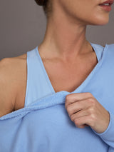 Close up of the Off Shoulder Sweatshirt in French Terry in Serenity highlighting raw edge neckline finish.