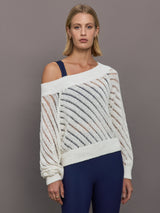 Model wears a white off shoulder mesh cardigan with diagonal pattern.  