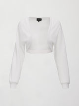 White long-sleeve shrug on a light gray background