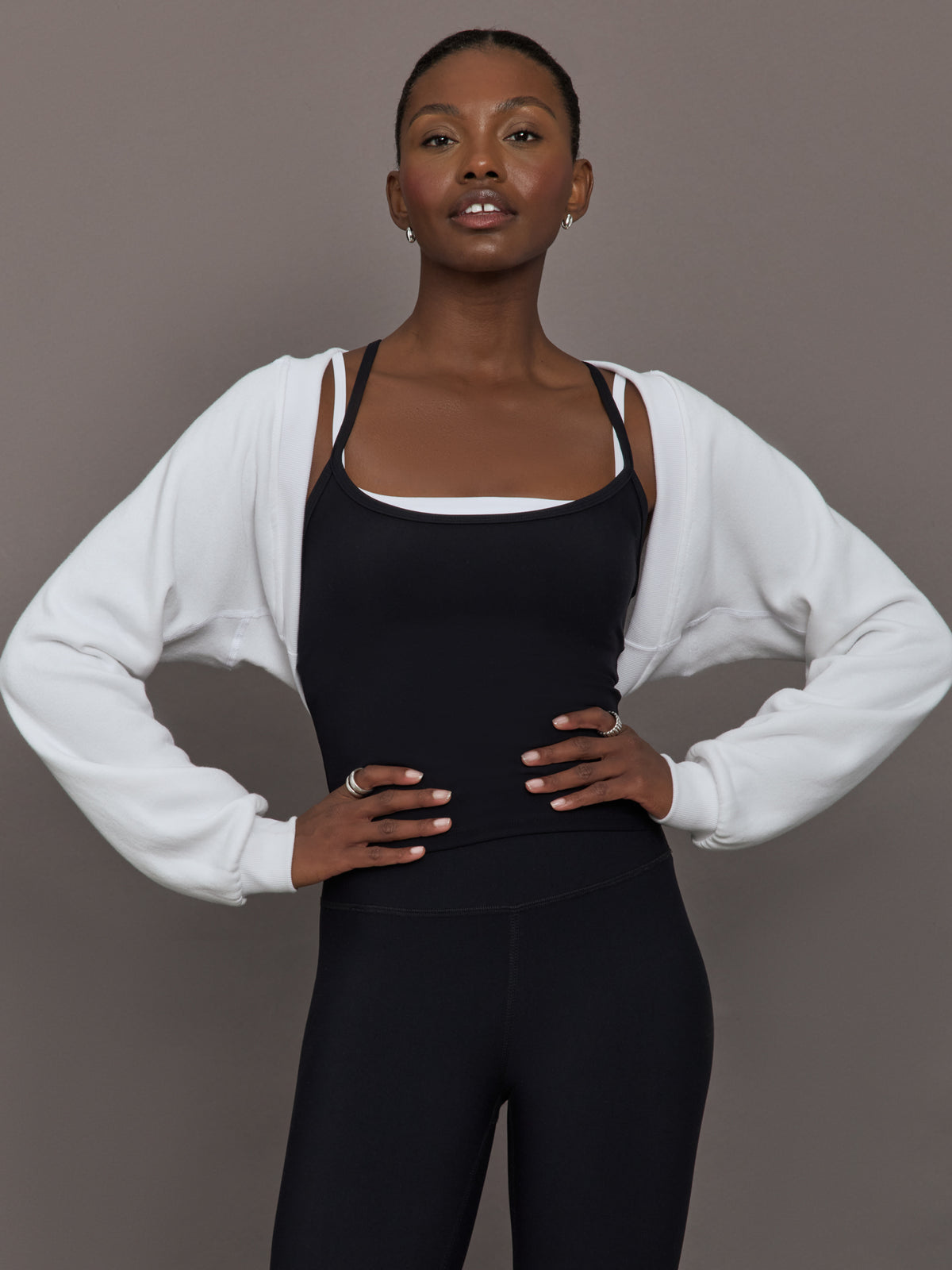 Model wearing fleece white long sleeve shrug.