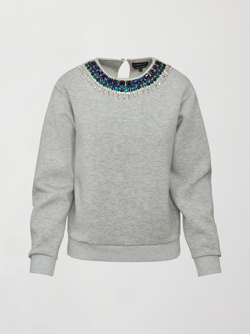 Flat lay of grey jewel embellished sweatshirt with long sleeves and crystal neckline on white background.