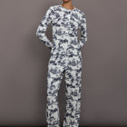 Model is wearing the cotton toile sleep set in navy toile, front full body view.