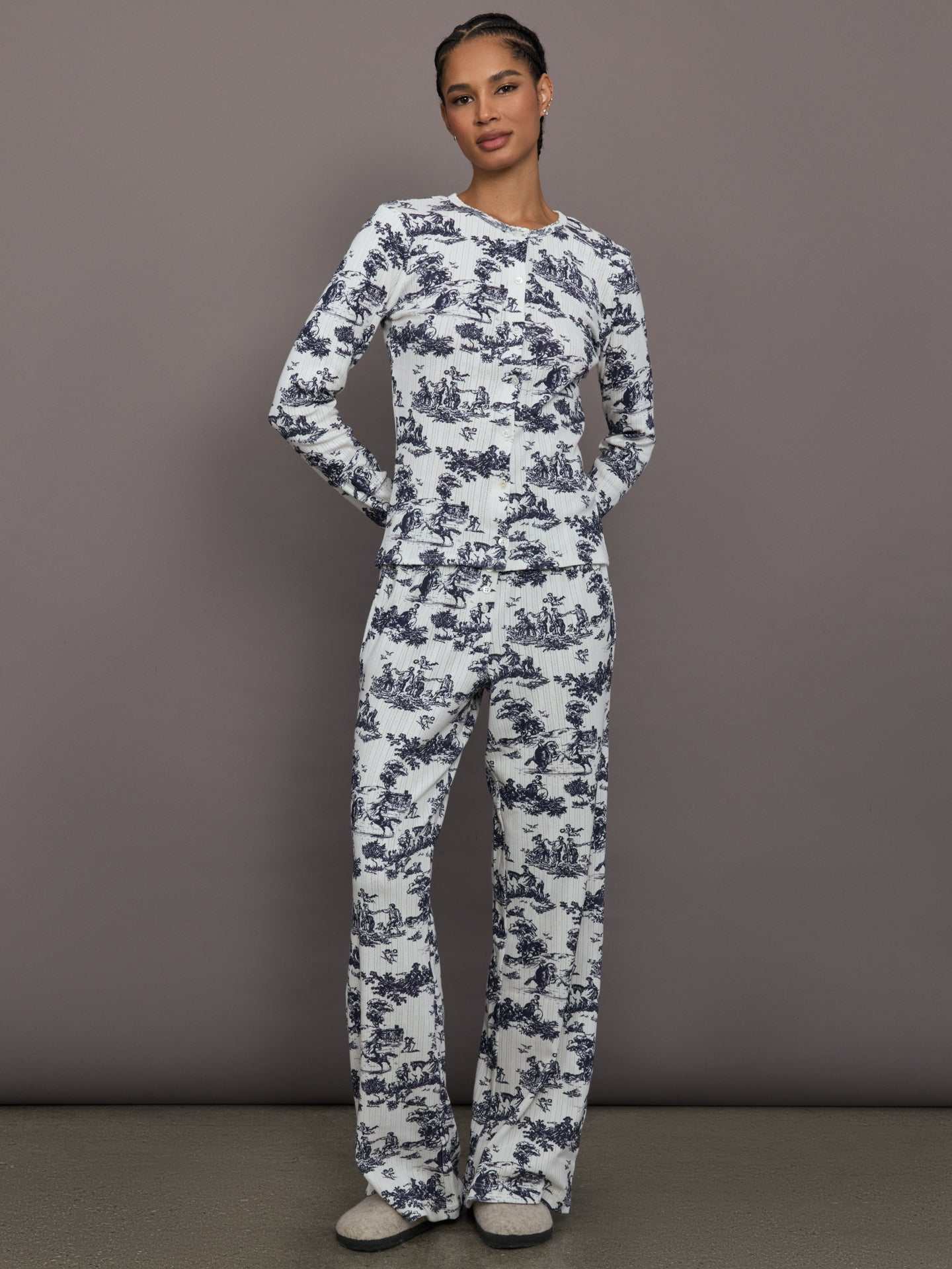 Model is wearing the cotton toile sleep set in navy toile, front full body view.