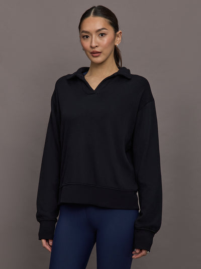 Model is wearing French Terry Johnny Collar Sweatshirt in Black, front view.