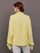 Model is wearing French Terry Johnny Collar Sweatshirt in Banana, back view.