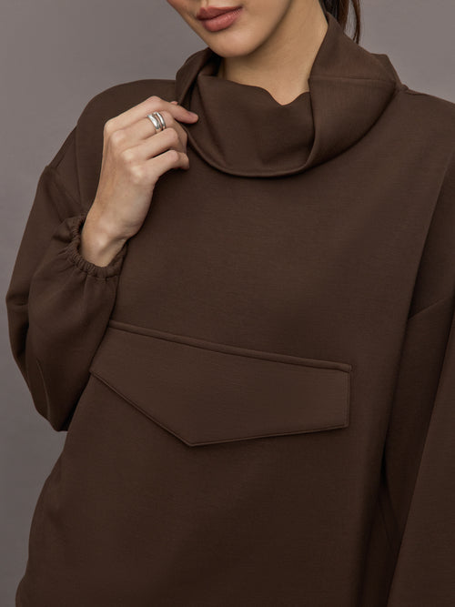 Model is wearing Scuba Funnel Neck Pullover in Carafe, close up of funnel neckline detail.