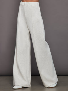 Front view of model wearing Interlock Pintuck Knit Pant in Moonbeam Heather with white loafers.