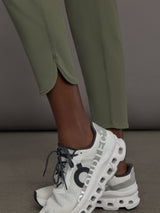 Model wears a pair of army green colored joggers with a thick waistband perfect for everyday activities. 