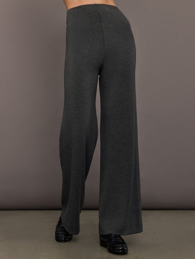 Model wearing high-waisted charcoal grey scuba pants with wide-leg fit, front view.
