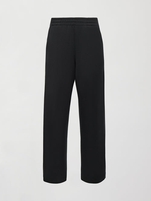 Flat lay of Interlock barrel leg pant in black, front view.