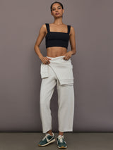 Model is wearing Interlock barrel leg pant in Moonbeam Heather, full body front view.