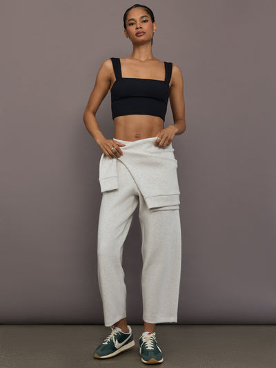 Model is wearing Interlock barrel leg pant in Moonbeam Heather, full body front view.