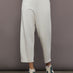 Model is wearing Interlock barrel leg pant in Moonbeam Heather, front view.