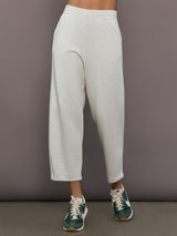 Model is wearing Interlock barrel leg pant in Moonbeam Heather, front view.