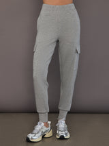 Model is wearing a heather grey Ultrasoft Cargo Jogger with flap pocket detail and tapered leg, front view.