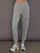 Model is wearing a heather grey Ultrasoft Cargo Jogger with flap pocket detail and tapered leg, front view.