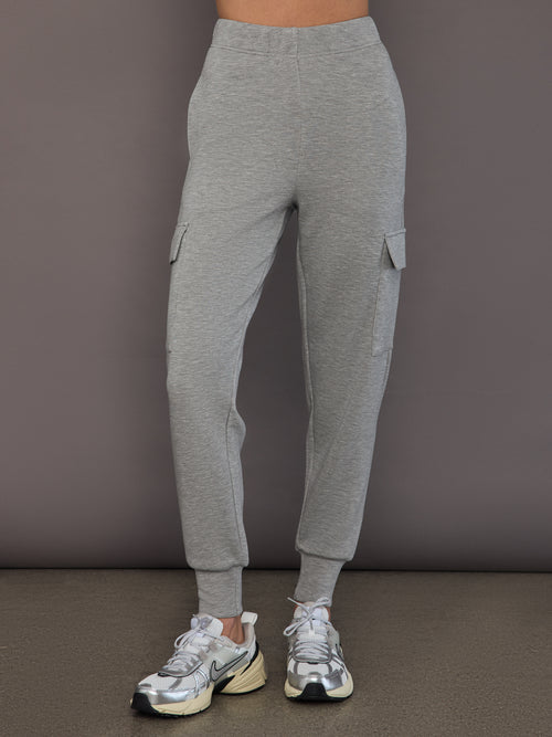 Model is wearing a heather grey Ultrasoft Cargo Jogger with flap pocket detail and tapered leg, front view.