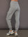 Model is wearing heather grey Ultrasoft Cargo Jogger with flap pocket detail and tapered leg, back view.