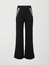 Flat lay front view of black wide-leg embellished pants with jeweled pockets on white background.