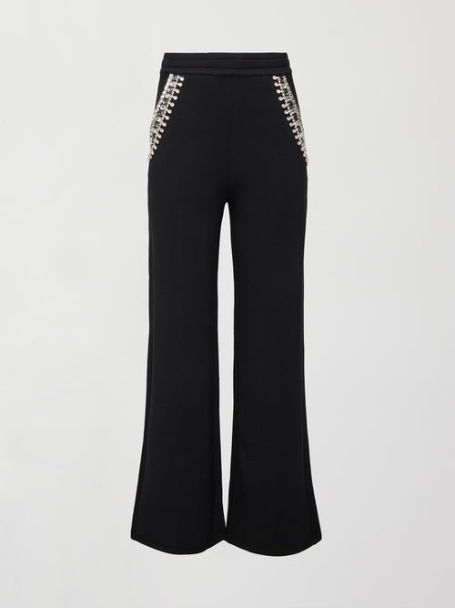 Flat lay front view of black wide-leg embellished pants with jeweled pockets on white background.