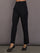 Model is wearing the scuba tuxedo pant in black, front view.