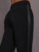 Close up of scuba tuxedo pant in black showing satin stripe.