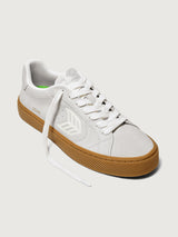 Suede white/light gray sneaker with light brown sole. 