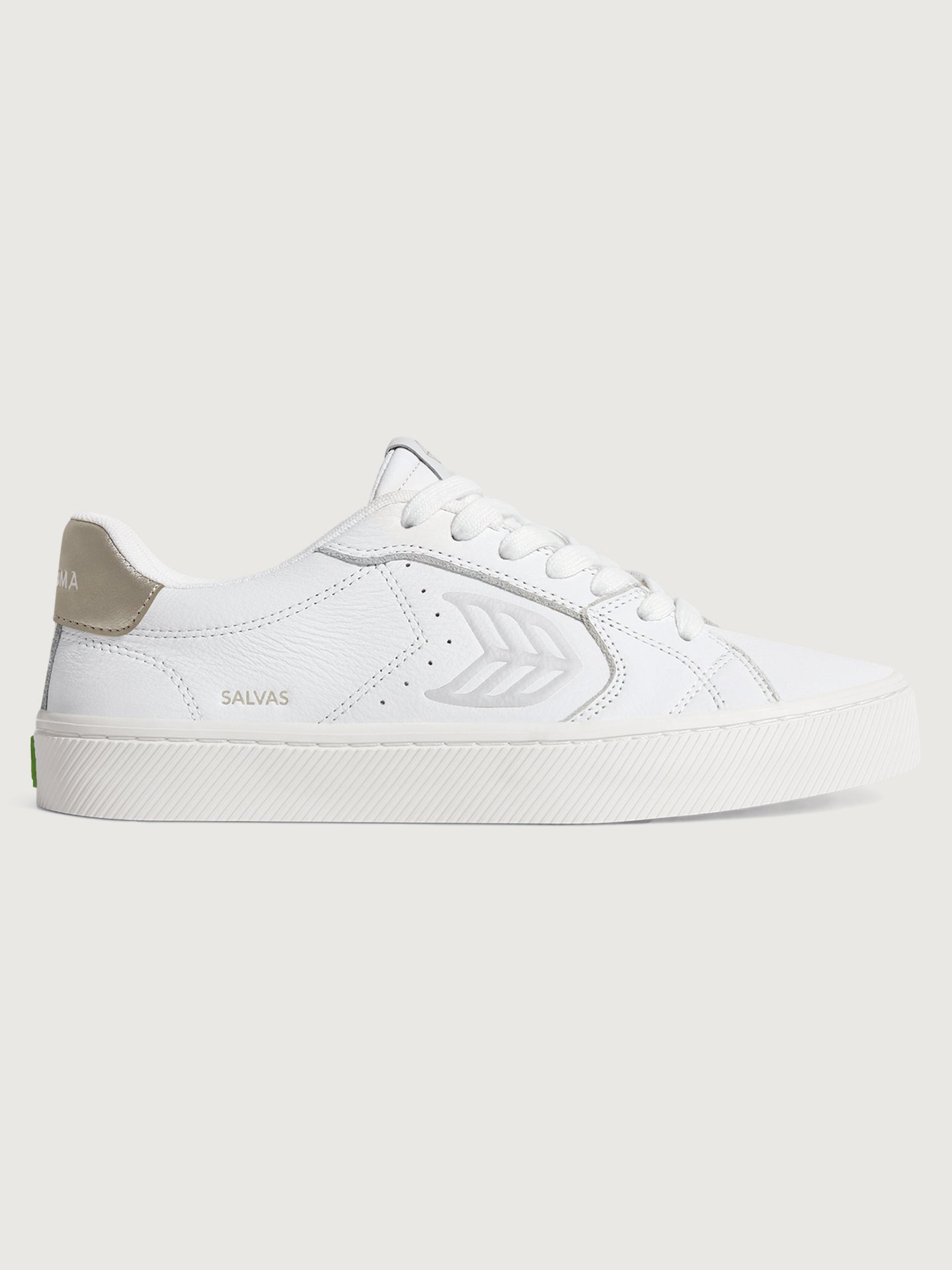 White sneaker with metallic gold heel and leaf logo on side. 