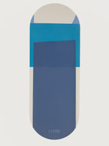 Navy Aeris yoga mat in Navy and Blue geometric design displayed flat with rounded edges and CARMU logo.