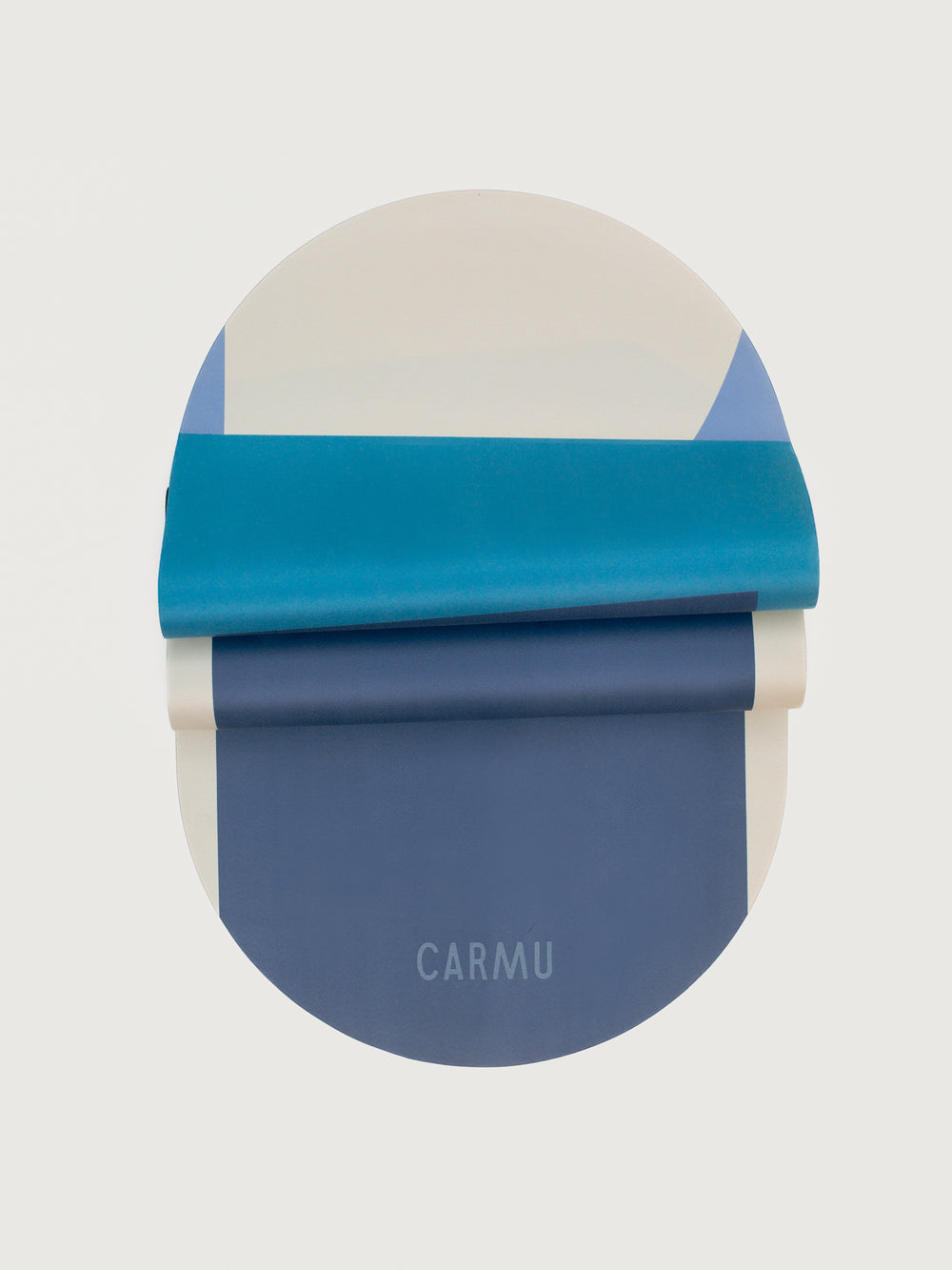 Navy Aeris yoga mat in Navy and Blue shown folded to highlight flexibility and bold colorblock pattern.