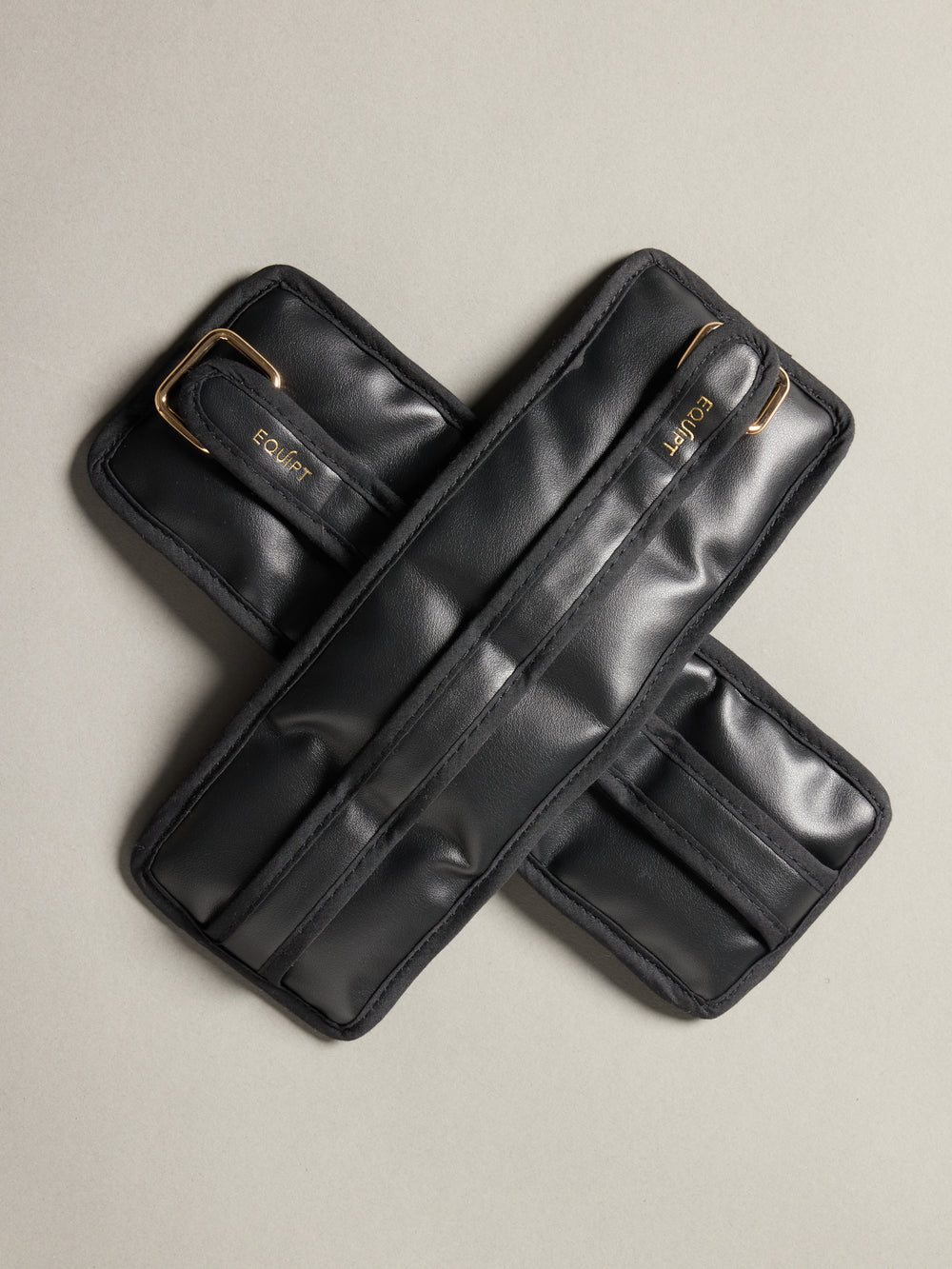 Flat lay of the Vegan Leather Weighted UWrap 1.5 Midnight Black, crossed strap detail.