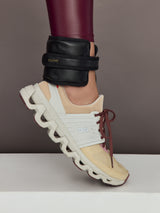 Model is wearing the Vegan Leather Weighted UWrap 1.5 Midnight Black, ankle view during movement.