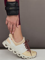 Model is wearing the Vegan Leather Weighted UWrap 1.5 Midnight Black, wrist view.