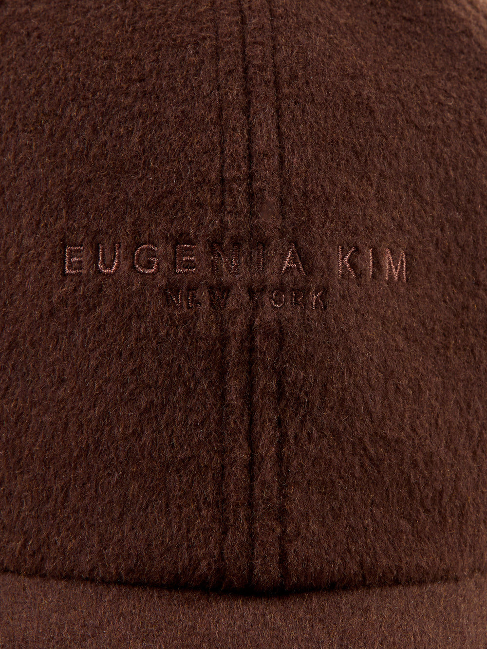 Brown baseball cap on a light gray background