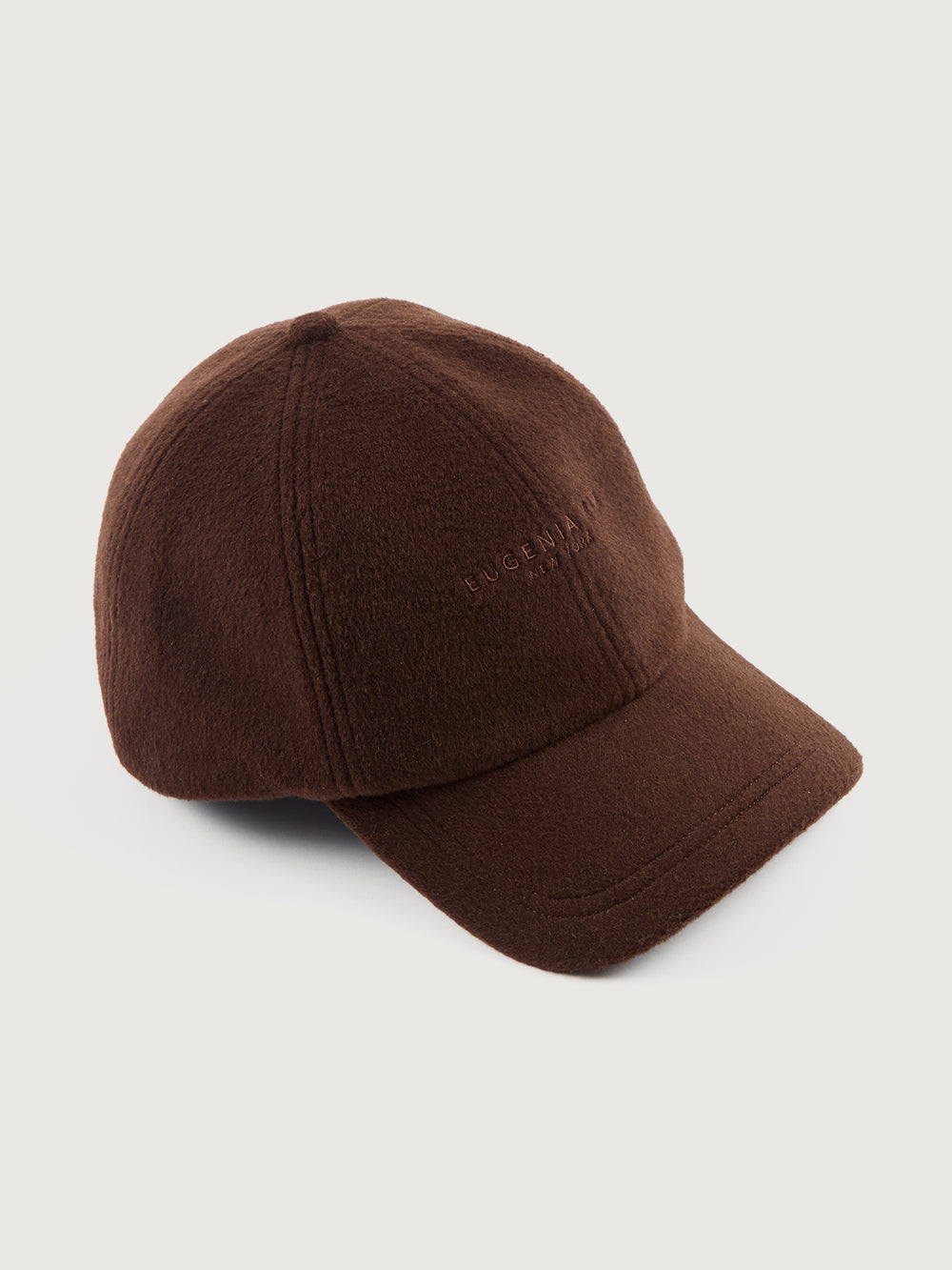 Brown baseball cap on a light gray background