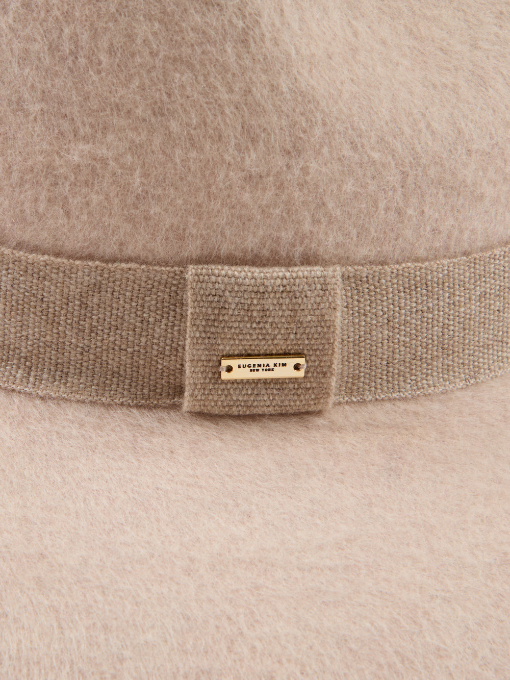 Beige wide-brimmed hat with a band.