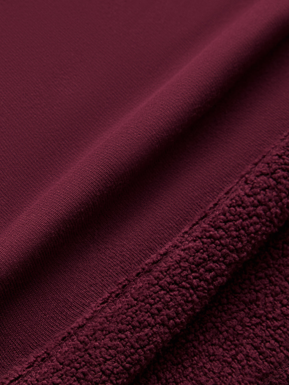 Model wearing off should sweatshirt in color fig