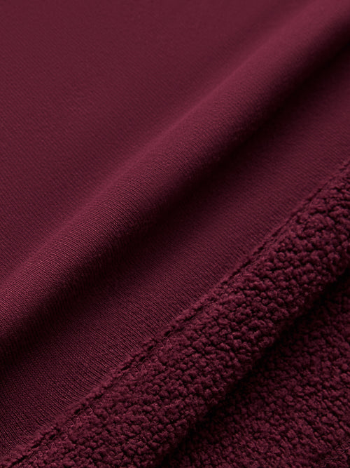 Model wearing off should sweatshirt in color fig