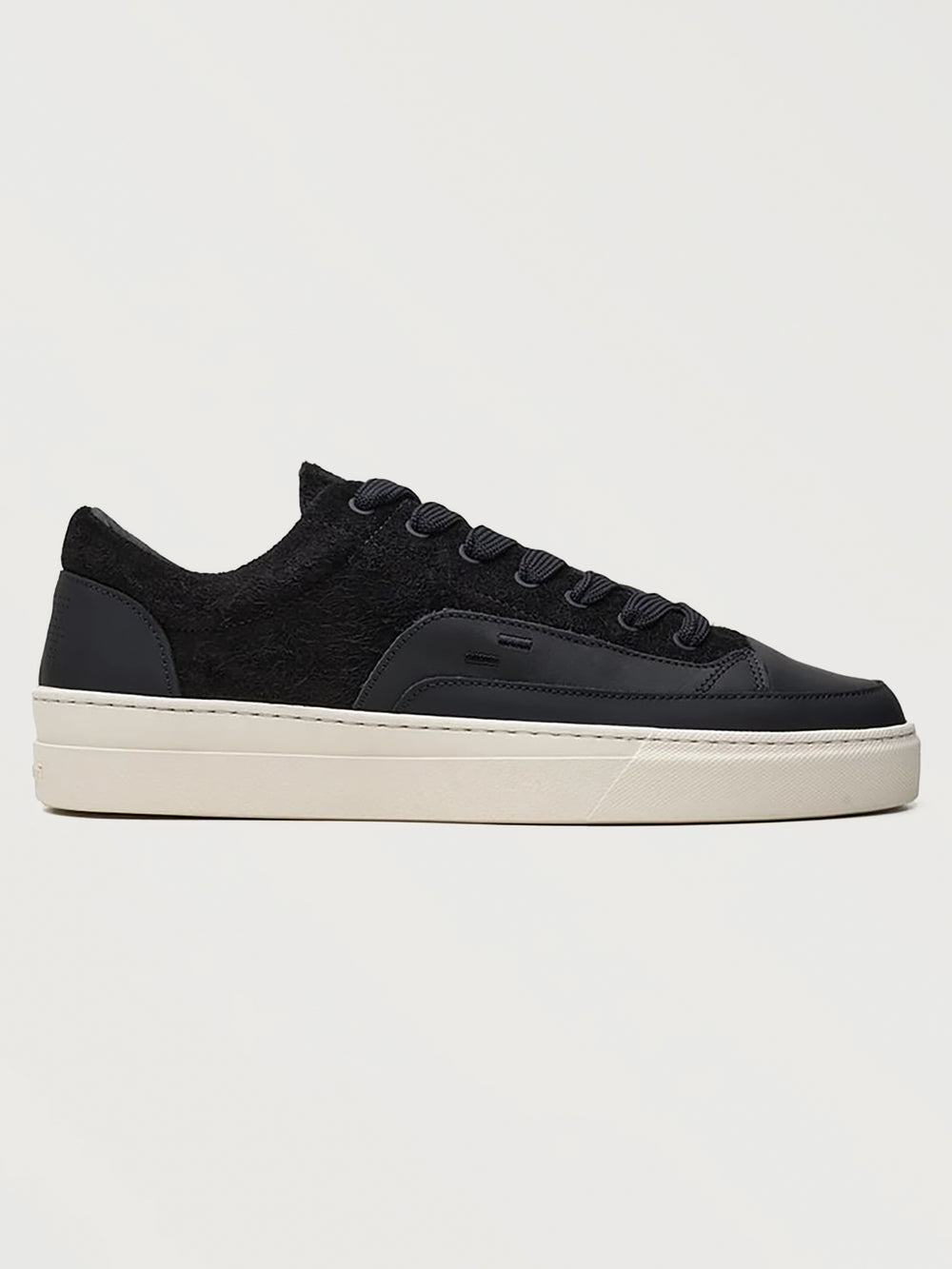 Filling Pieces Riviera Fuzz sneaker in black with textured suede upper, smooth leather overlays, and white rubber sole, side view.