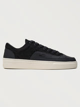 Filling Pieces Riviera Fuzz sneaker in black with textured suede upper, smooth leather overlays, and white rubber sole, side view.