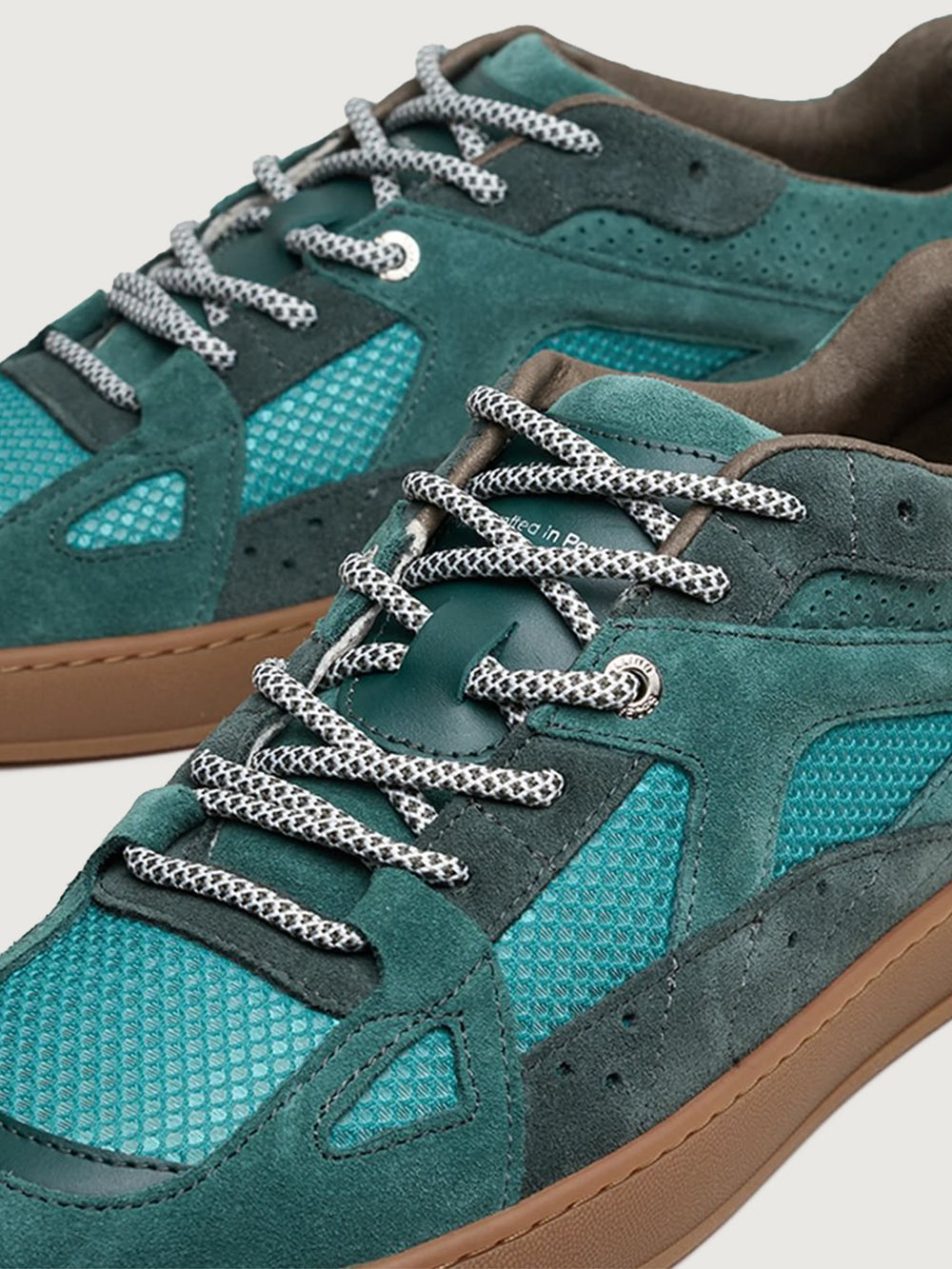 Close-up of Filling Pieces Prism Peak sneaker in green with textured mesh panels, suede overlays, and contrast laces.
