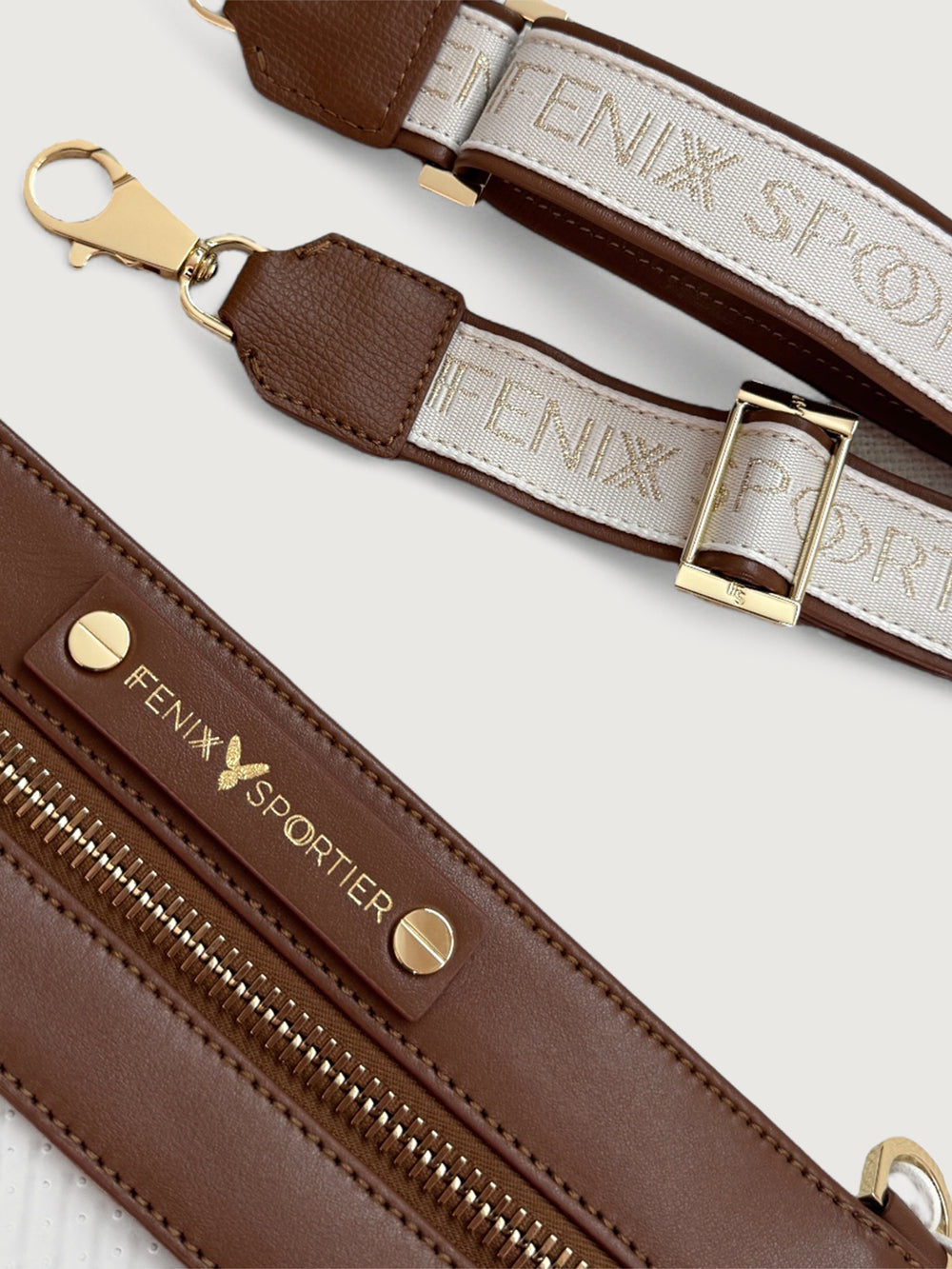 Detachable canvas strap with Fenix Sportier logo in gold lettering and brown leather trim.