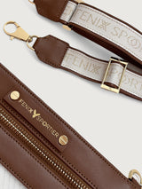 Detachable canvas strap with Fenix Sportier logo in gold lettering and brown leather trim.