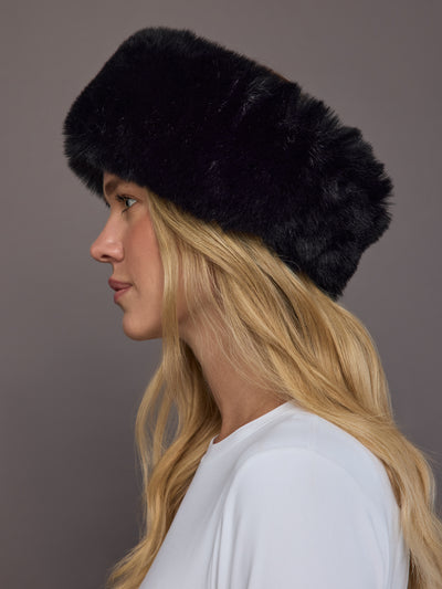 Black faux fur headband on model, side profile view.