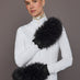 Black leather faux fur mittens on model, front arm view.